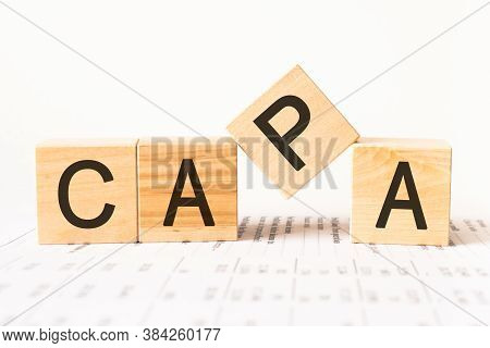 Word Capa. Wooden Small Cubes With Letters Isolated On White Background With Copy Space Available