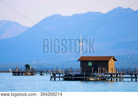 September 3, 2020 In Lake Tahoe, Ca:  Historical Wooden Boathouse On The End Of A Pier Taken At Suga