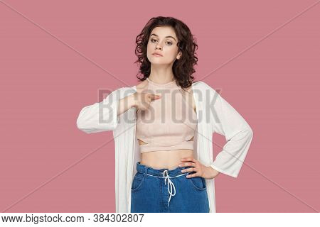This Is Me. Portrait Of Haughty Proud Beautiful Brunette Young Woman With Curly Hairstyle In Casual