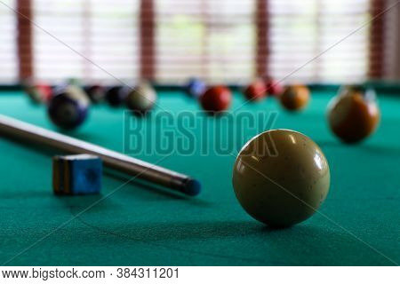 White Ball And Cue Stick On Pool Table