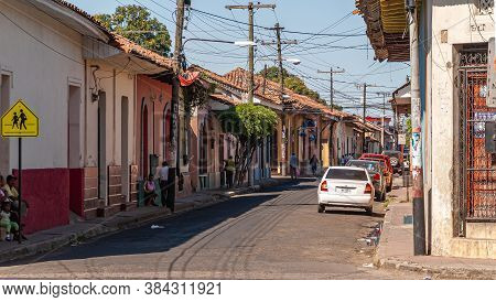 Leon, Nicaragua - November 27, 2008: Folksy Quiet Street With Single-level Houses With Red Roofs Dow