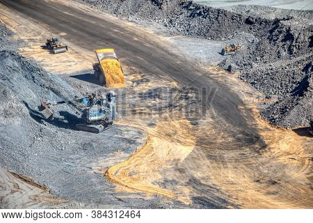 excavator, bulldozer and truck in  a diamond mine in Botswana