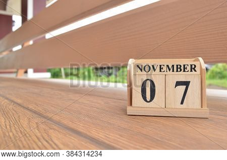 November 7, Number Cube With Wooden Balcony Background.