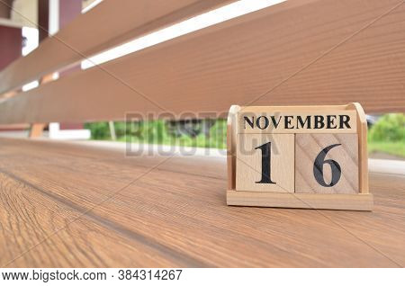 November 19, Number Cube With Wooden Balcony Background.