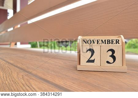 November 23, Number Cube With Wooden Balcony Background.