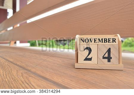 November 24, Number Cube With Wooden Balcony Background.