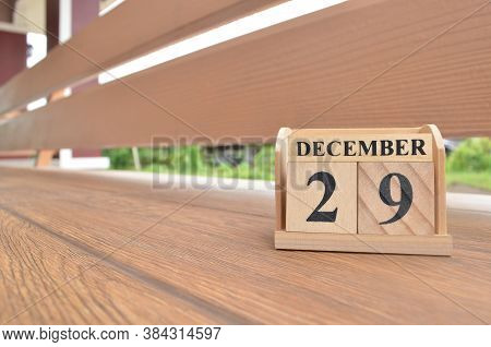 December 29, Number Cube With Wooden Balcony Background.