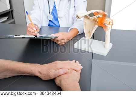 Rheumatologist And Senior Patient, Consultation. Recovery From A Clavicle Fracture