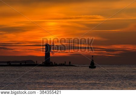 Navigation Sign On The Breakwater - Sunset On The Seashore In Swinoujscie