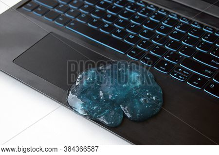 Blue Soft Gel Cleaning Dust On Keyboard. Concept Cleaning Your Computers Keyboard. Office Cleaning.