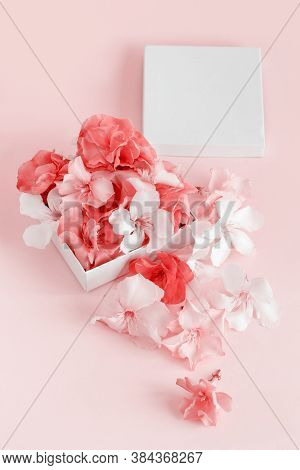 Gift Box Full Of Flowers  Over A Pink Background  Close Up