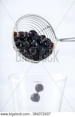 Making Bubble Tea, Scoop And Pour Cooked Brown Sugar Flavor Tapioca Pearl Bubble Balls Into Cup On W