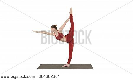 Slim Woman Standing In Yoga Pose Dandayamana Dhanurasana On White Background.