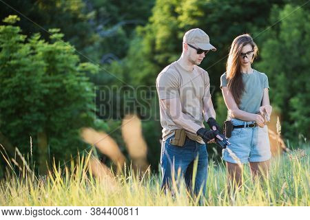 The Instructor Teaches The Girl To Shoot A Pistol At The Range