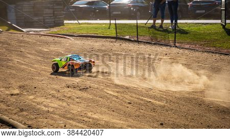 Rc Shortcourse Going Down The Main Straight And Leaving Dust Trail Behind