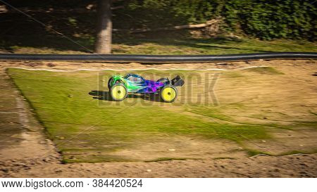 Rc Truggy Going Straight Towards A Jump