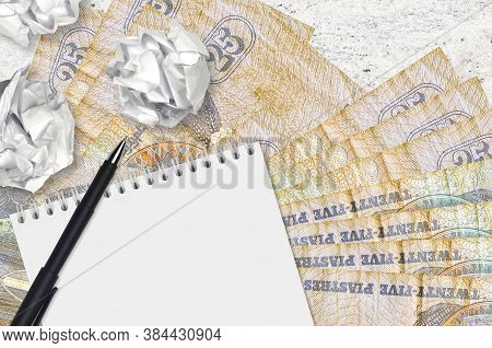 25 Egyptian Piastres Bills And Balls Of Crumpled Paper With Blank Notepad. Bad Ideas Or Less Of Insp