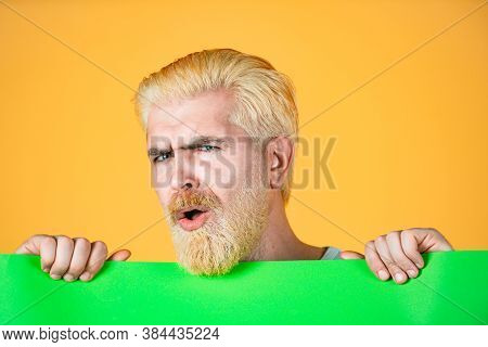 Male Model Holding White Board. Area For Advertising. Blank, Empty Paper, Billboard With Copy Space 