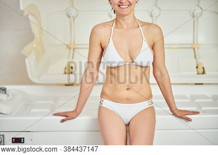 Beautiful Woman In Swimsuit Before The Body Shape Correction