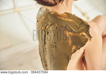 Brown Wet Body Mask On The Skin Of Woman