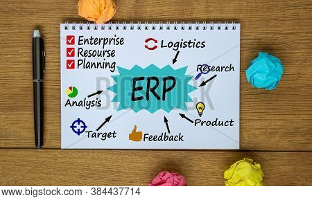 Notebook, Pen And Notes About Erp. Colored Paper. Business Concept.