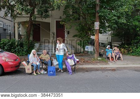 New Orleans, Louisiana/usa - 8/15/2020: Neighborhood Spectators Enjoying Front Porch Concert In Upto