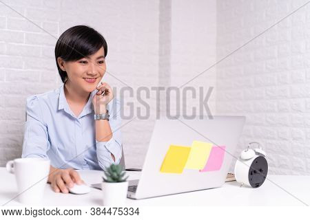Happy Woman Sitting At Home Office Working Using Computer Laptop