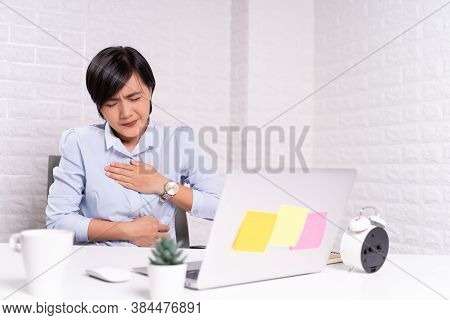 Woman Has Stomachache At Office