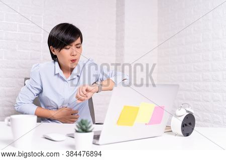 Woman Has Stomachache At Office