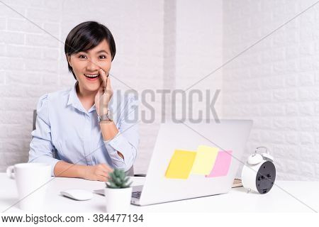 Woman Sitting At Home Office Using Computer Laptop And Saying Secret News