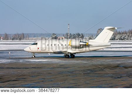 White Private Plane In A Cold Winter Airport