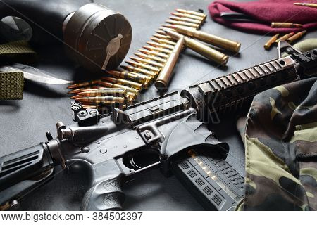 Assault Rifle (m4a1)  With Ammunition On Camouflage Uniform,and Military Equipment For Army,bullets 