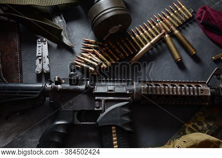 Assault Rifle (m4a1)  With Ammunition On Camouflage Uniform,and Military Equipment For Army,bullets 