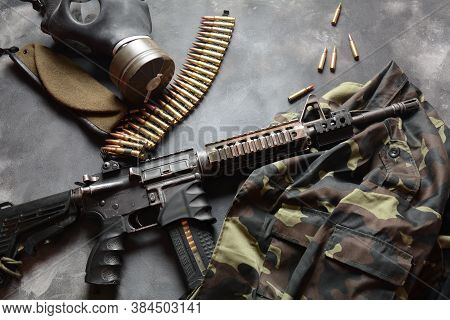 Assault Rifle (m4a1)  With Ammunition On Camouflage Uniform,and Military Equipment For Army,bullets 