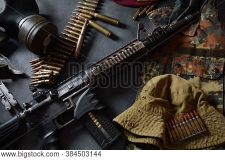 Assault Rifle (m4a1)  With Ammunition On Camouflage Uniform,and Military Equipment For Army,bullets 