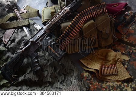 Assault Rifle (m4a1)  With Ammunition On Camouflage Uniform,and Military Equipment For Army,bullets 