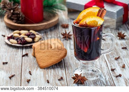 Glass Of Red Glogg Or Mulled Wine With Orange Slices And Cinnamon Stick, Gingerbread Cookies And Gif