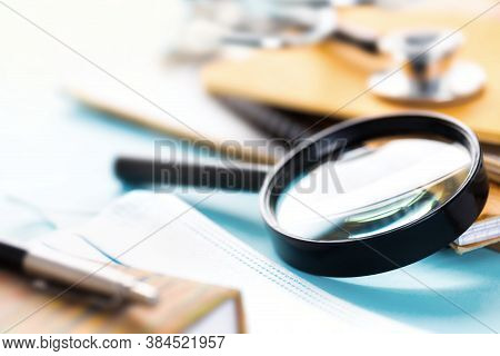 Doctors Workplace With Magnifying Glass Stethoscope Or Phonendoscope Notebooks And Documents