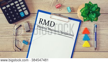 Paper With Required Minimum Distributions Rmd On A Table, Calculator And Glasses