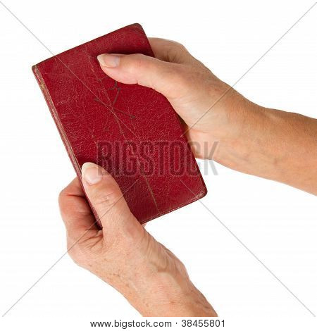 Old Hands (woman) Holding A Very Old Bible