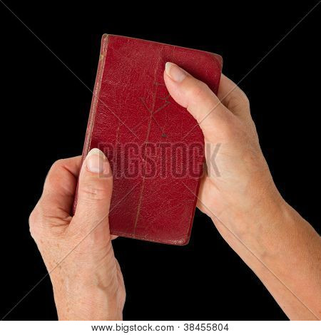Old Hands (woman) Holding A Very Old Bible