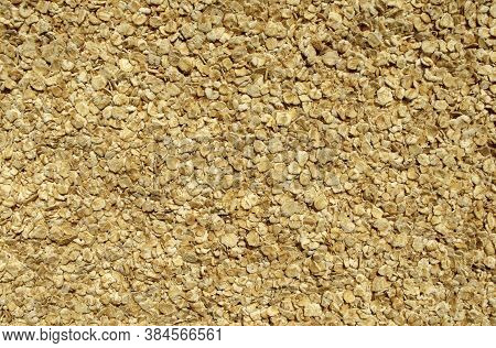 Fresh Wholegrain Oats Background. Raw Oatflakes Backdrop. Top View