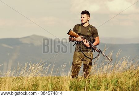 Hunter Spend Leisure Hunting. Hunting Equipment. Brutal Masculine Hobby. Man Observing Nature Backgr