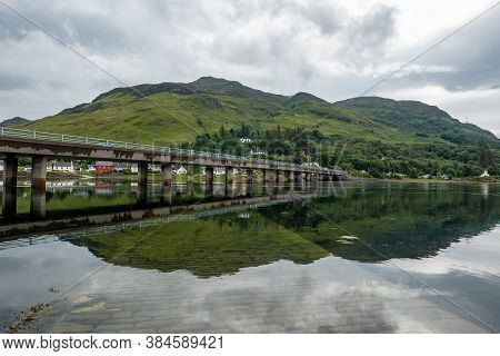The A87 Road Bridge Above Loch Long In Dornie Town In Scotland, Uk Near The Famous Eilean Donan Cast