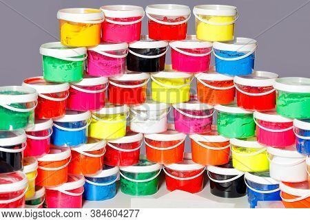 Screen-printing Ink In A Variety Of Vibrant Colors Is Laid Out In A Semicircle And A Slide In Transp