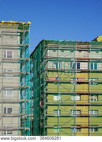 Scaffolding Arround The House To Install Thermal Insulation Of The Apartment Building Facade