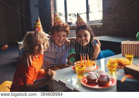 Three Kids Celebrating Bday And Feeling Wonderful