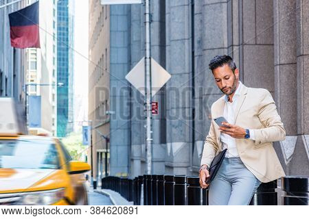 Young European Businessman Traveling, Working In New York, With Beard, Little Gray Hair, Wearing Bei