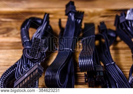 Set Of Computer Psu Cables On Wooden Background