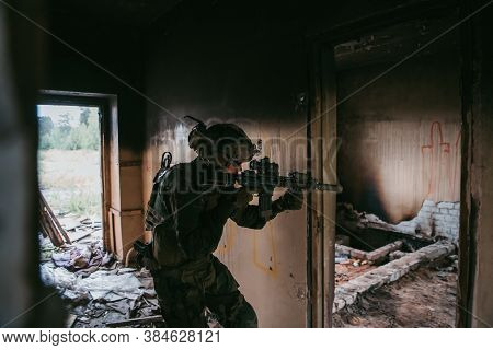 Soldier In Full Us Marsoc Equipment Entering Abandoned Building, Aiming Different Angles With Mk18 A